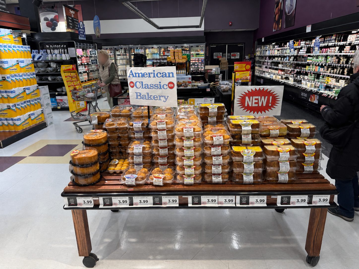American Classic Bakery products on a supermarket display table.